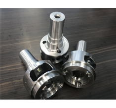 By CNC and cylindrical grinding
