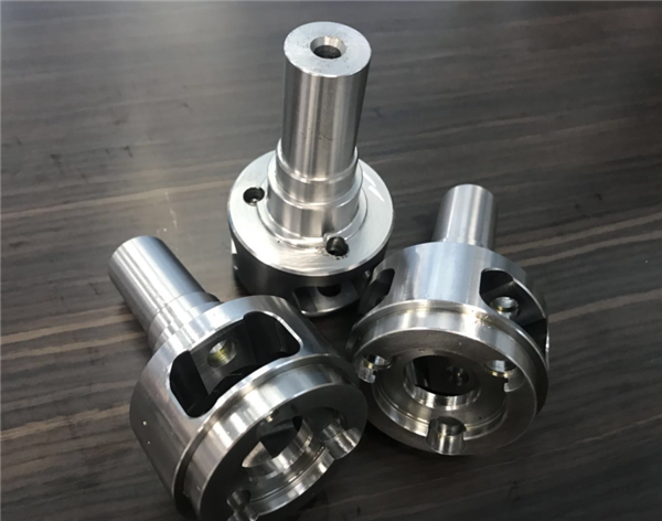 By CNC and cylindrical grinding